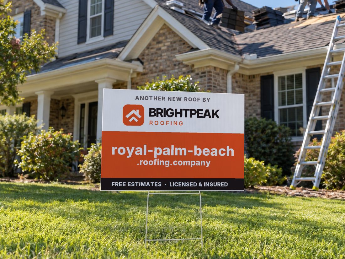 royal-palm-beach.roofing.company on a yard sign in front of a house getting a new roof